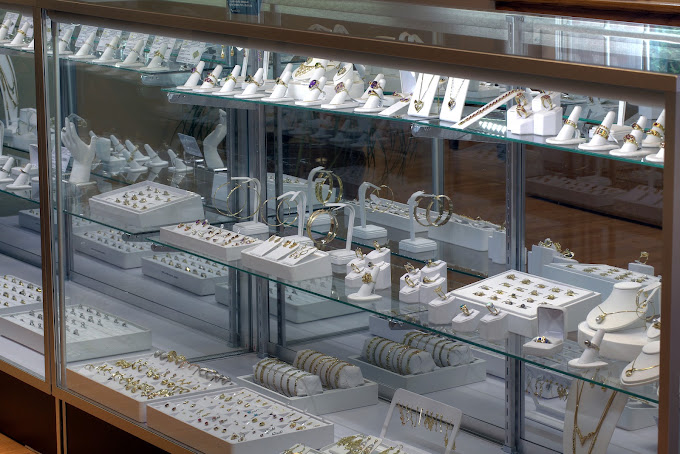 Jewelry display case with rings, bracelets, and necklaces