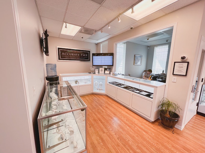 Accurate Precious Metals showroom in Salem, with jewelry cases and the Accurate PMR sign