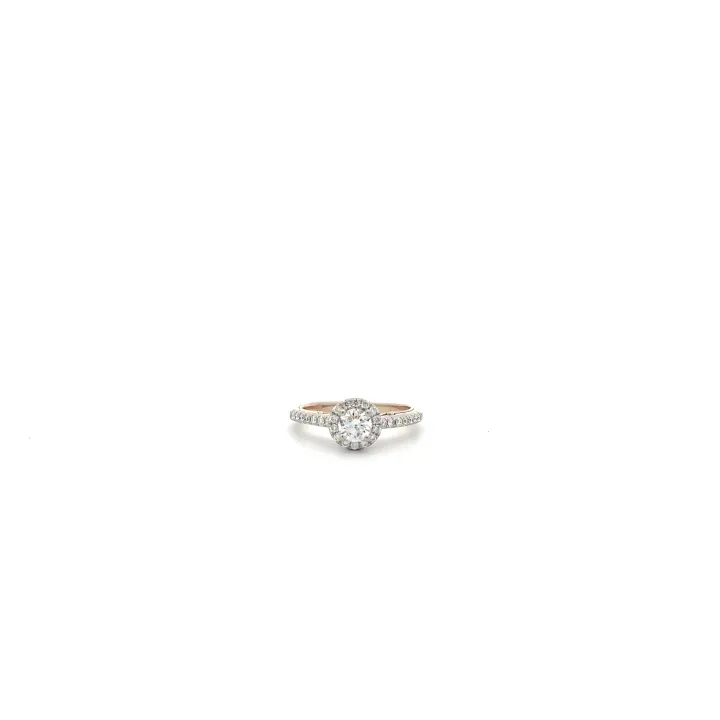 Round diamond halo engagement ring with a two-tone rose and white gold band on a white background
