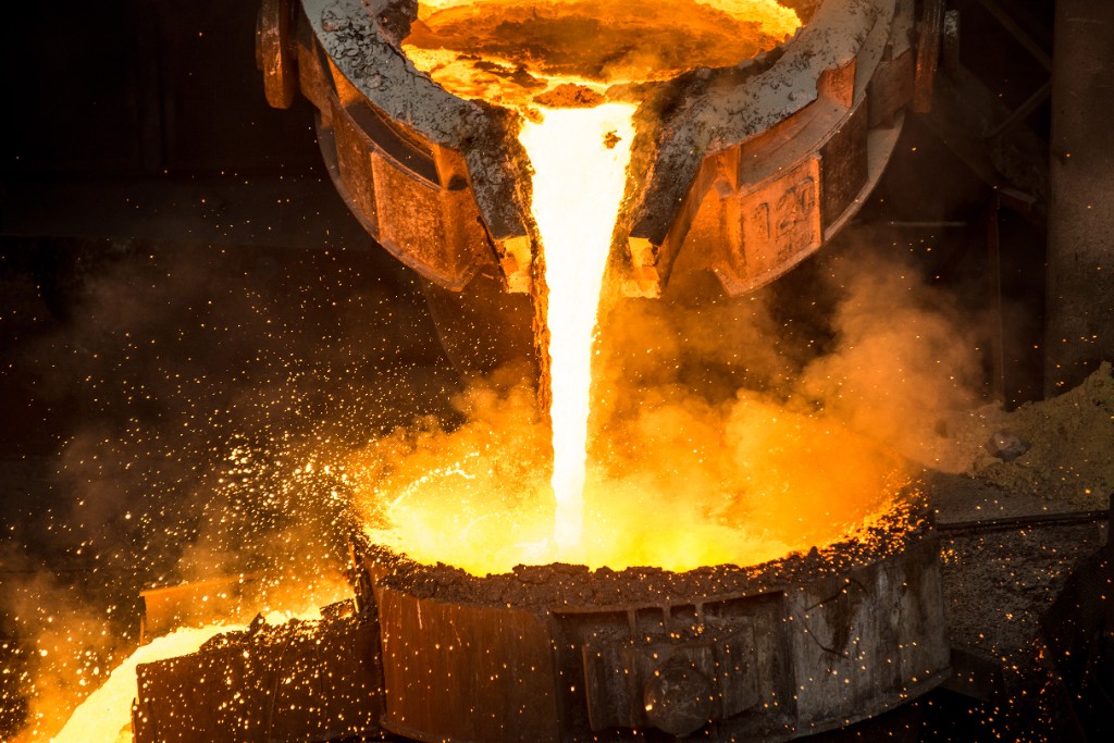 Molten metal poured from a crucible in the refinery
