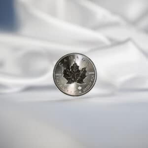 A Silver Maple Leaf coin on a white background.
