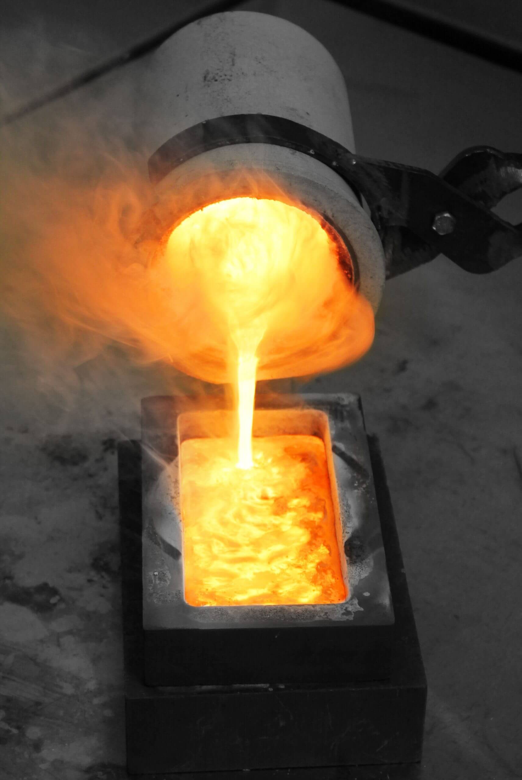 We pour liquid gold from the crucible into the mold to form a gold bar