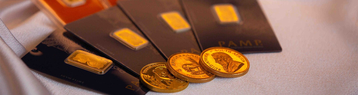 Gold bars and coins displayed together, showcasing various forms of valuable gold investments and financial security