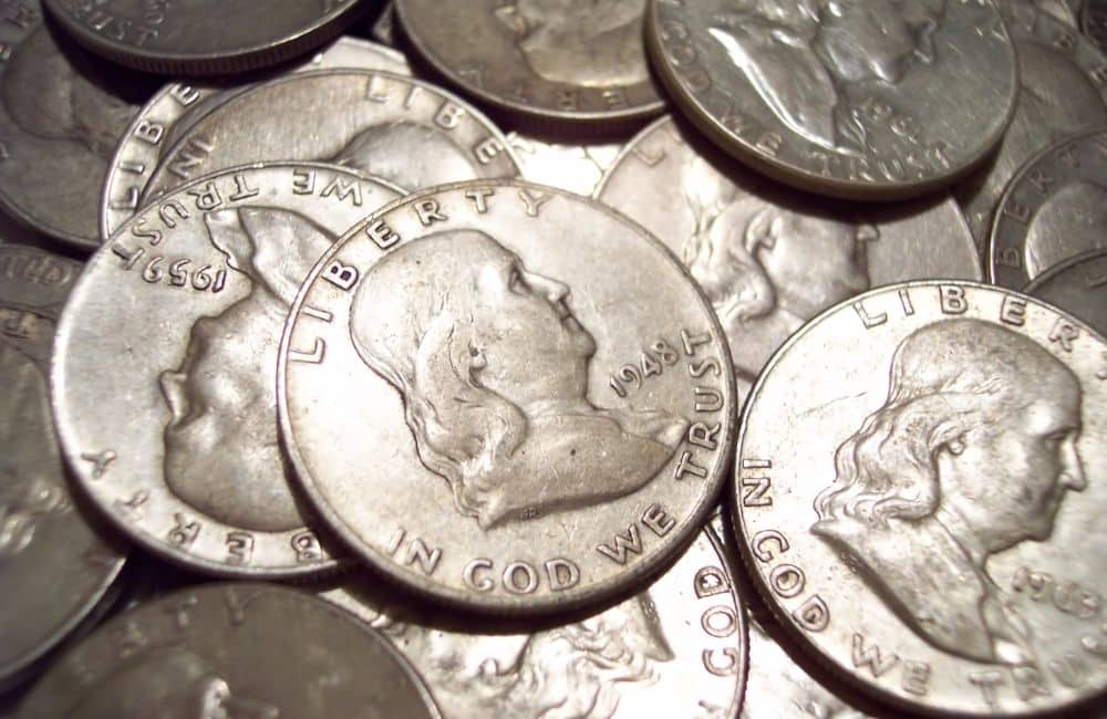 Image offering information on the worth and melt value of silver half-dollar coins.