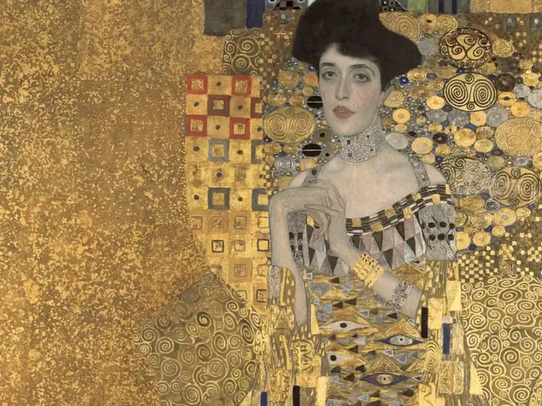 Artistic portrait of a woman with gold accents, inspired by Gustav Klimt's style, emphasizing luxury.